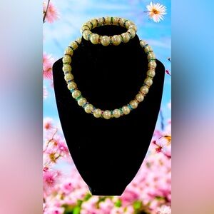 A gorgeous glass pearl with matching bracelet and multi color rondel spacers.